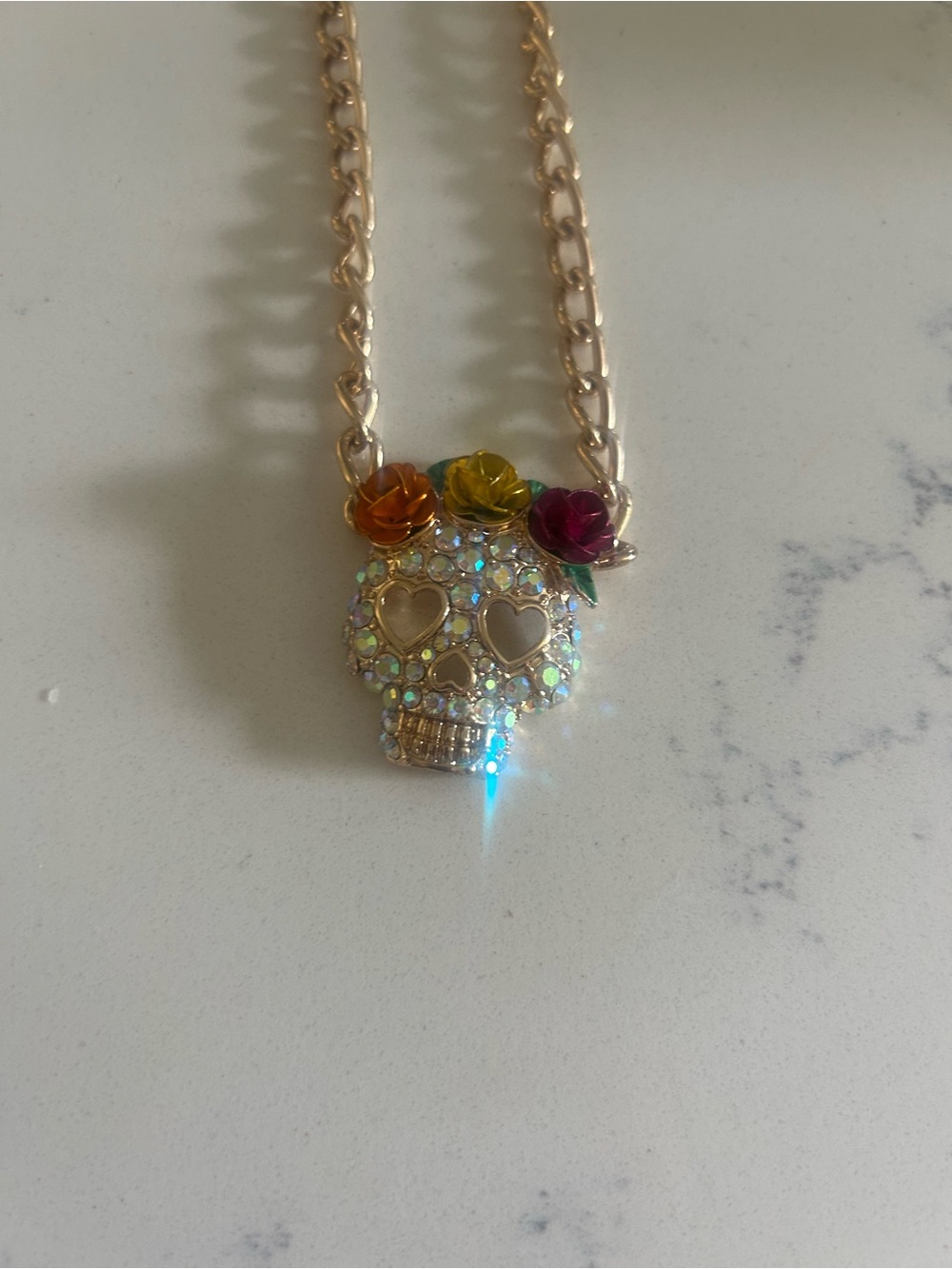 Gold-Tone Crystal Skull Necklace with Pink, Yellow and Orange Flower Accents